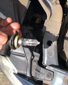 Headlight globe in hand