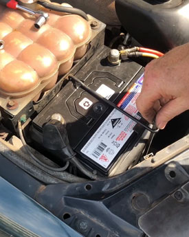 Image of tightening battery terminals.